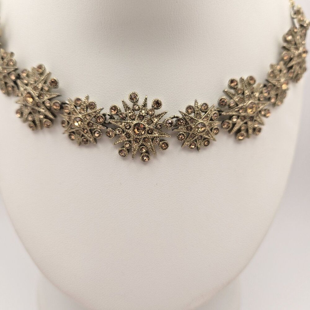 Monet | Gold Tone Starburst/Snowflake Necklace Champagne Rhinestones